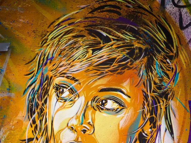 In this image we can see the art of a woman on the surface which is in yellow color and a few more...