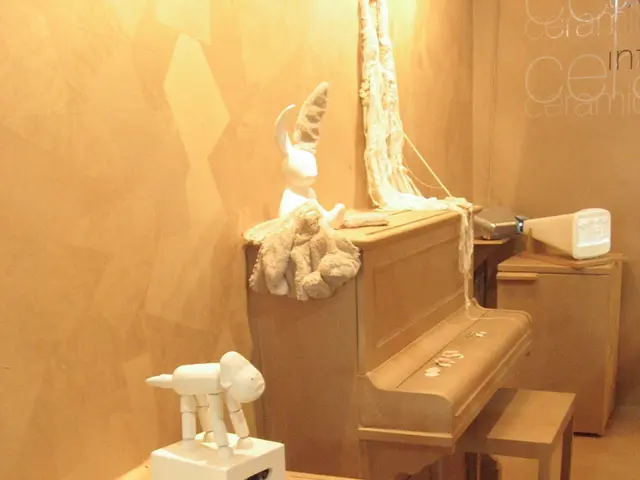 In this image I see a room in which there are cabinets, a keyboard and few toys and the wall.