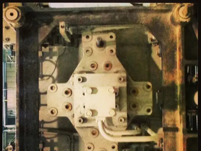 In this image there is a metal structure.
