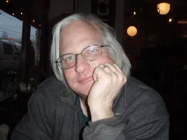 In this image there is a man in the middle who kept his hand on his face. On the left side there is...