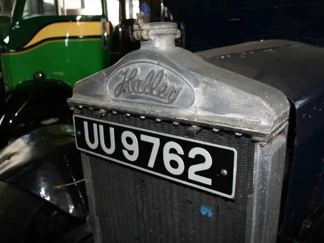 In this image we can see triumph herald and some text on it. In the background the image is in a...