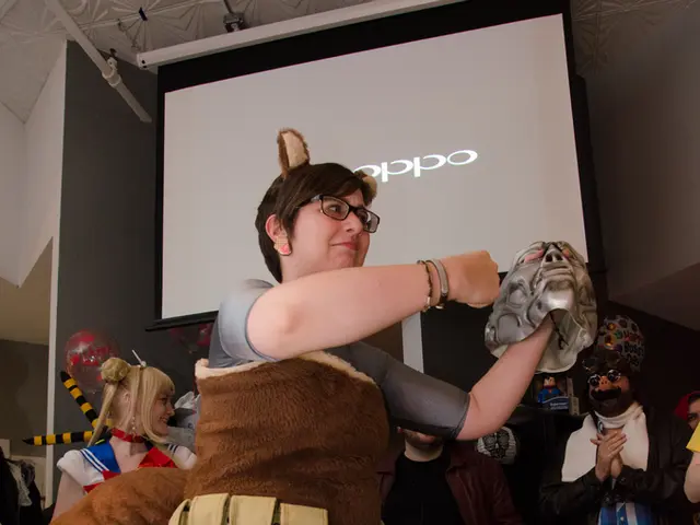 In this picture we can see a woman wearing brown color jacket holding silver mask in the hand and...