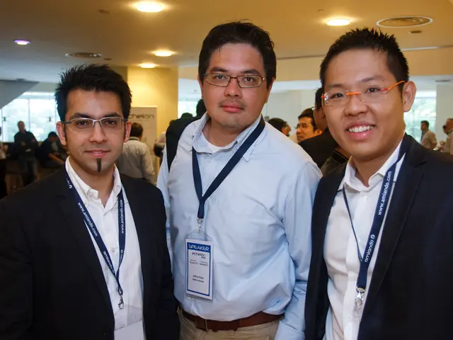 In this image I can see a group of people are standing. In front I can see few people are wearing...