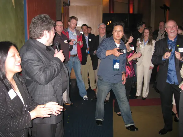 In this picture we can observe some people standing on the floor. There are men and women in this...