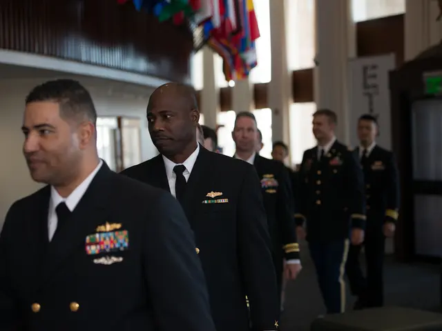 In the picture I can see these people wearing black blazers, ties and shirts are walking on the...