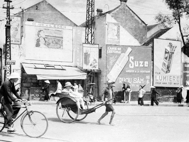 As we can see in the image there is a sky, current pole, house, banner, few people here and there....