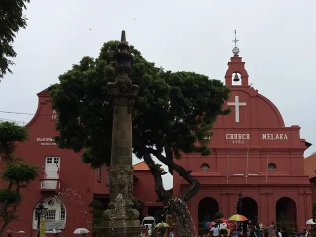 This picture shows couple of buildings and we see few people walking and few are standing and we...