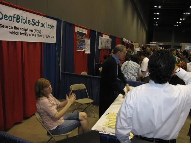 In this picture there are several people in their respective stalls and the background is made of...