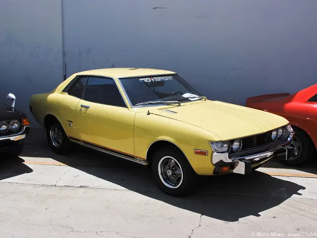 In this image I can see few cars and here on this windshield I can see something is written. I can...