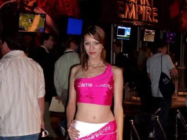 Here in this picture in the middle we can see a woman standing on the floor and smiling and behind...