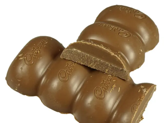 In this image I can see chocolates in brown color and cadbury written on it.