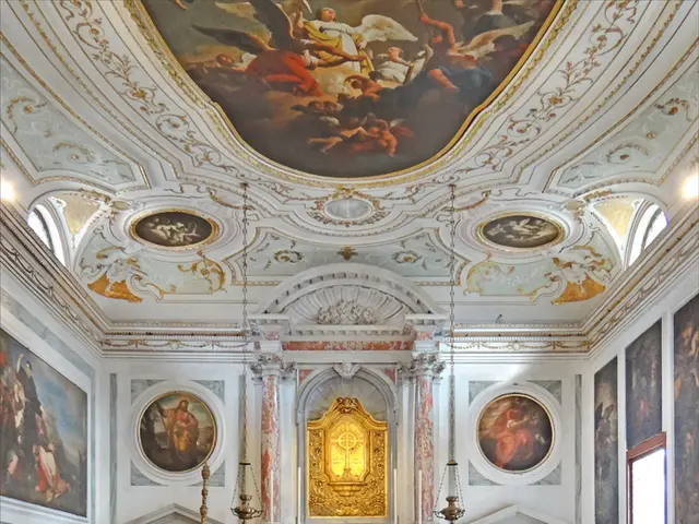 In this image I can see number of chairs and on these walls and on this ceiling I can see number of...