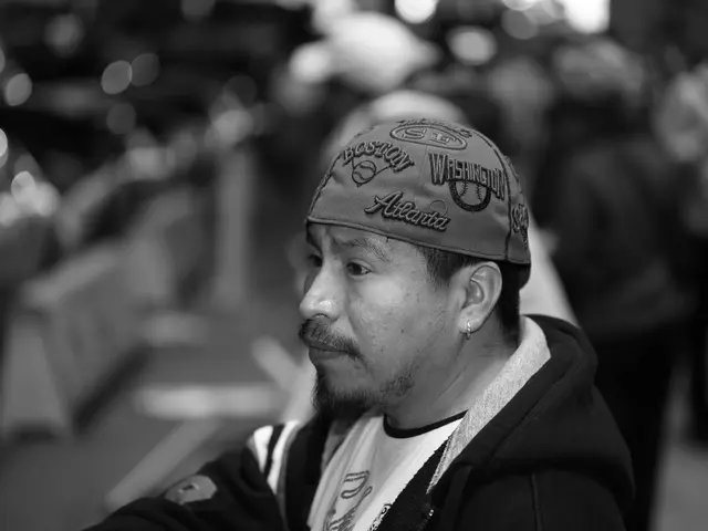 This image is a black and white image. This image is taken outdoors. In this image the background...