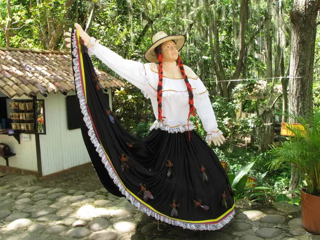 In this image we can see a statue wearing a hat. In the back there is a shed. Also there are trees....