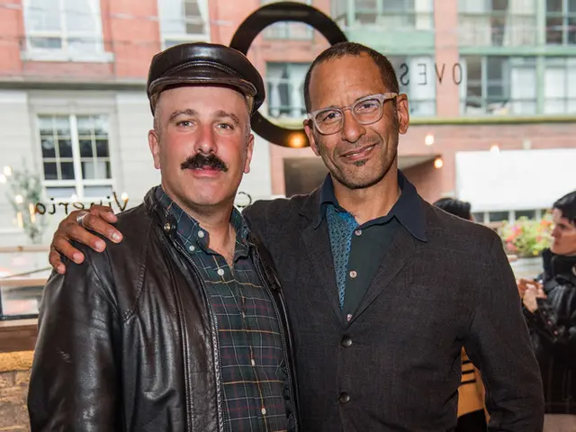 In this image I can see two men are standing where one is wearing a cap and another one is wearing...