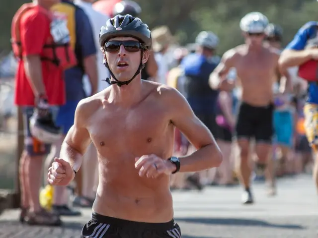 In this picture we can see people wearing helmets and shorts. They are running on the ground.