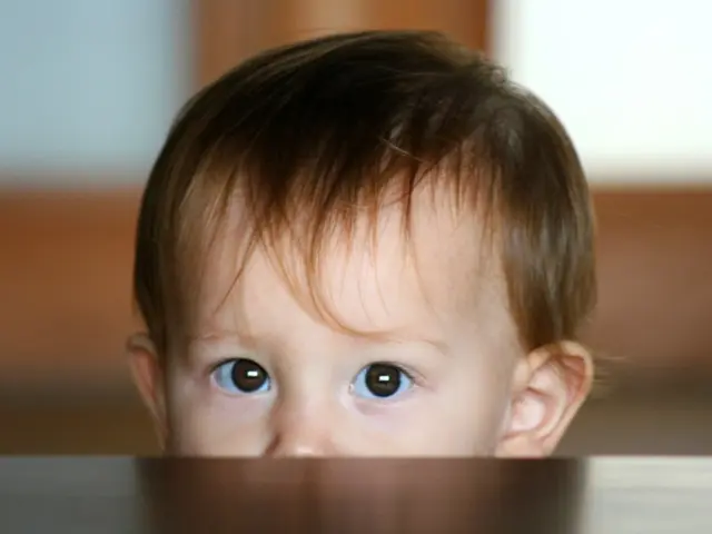 Here we can see baby face. Background it is blur.