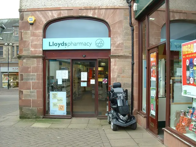 There is a pharmacy store and there is a vehicle in front of it and there is a building in the left...