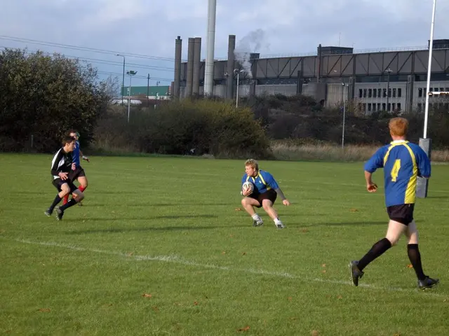 Here, some boys are playing american football. In which two are running to catch the ball. The boy...