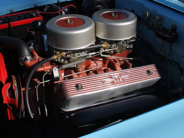 In this picture I can see machine which has wires, pipes and other objects attached to it.