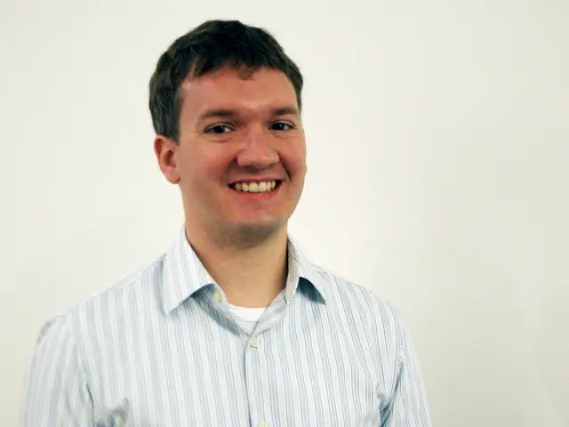 In this image there is a person with a smile on his face.