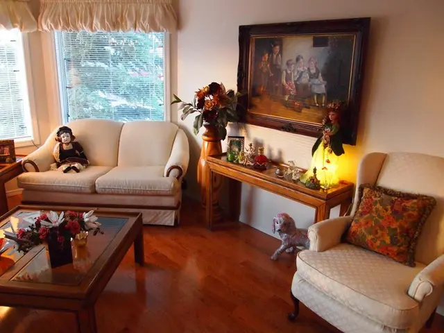 These are couches. On this couch there is a toy. On this couch there is a pillow. On this table...