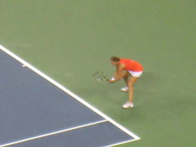 In the image there is a person playing tennis,she is holding the tennis racket with her both hands...