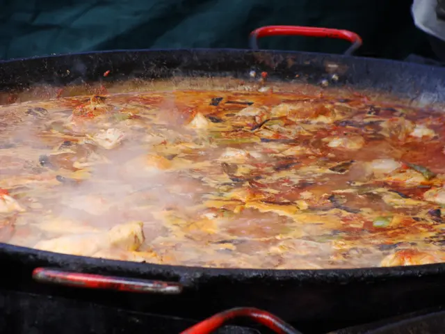 In this image we can see the food item cooking in the pan.