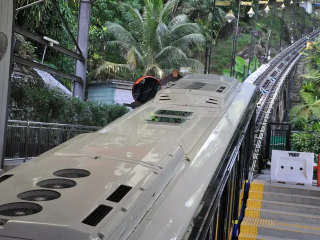 In this picture there is a train on the railway track. On the left side of the image there are...