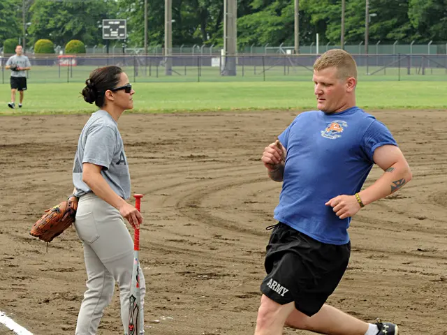 In this image we can see this person wearing blue T-shirt, socks and shoes is walking on the...