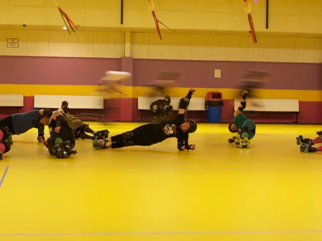 There are many people wearing helmets, elbow pads, knee pads and skating shoes. In the back there...