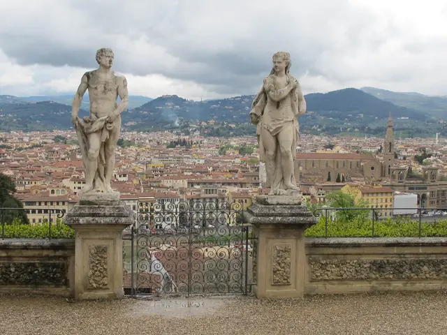 In this image we can see statues on pedestals. Also there is a gate and railings on the walls. In...