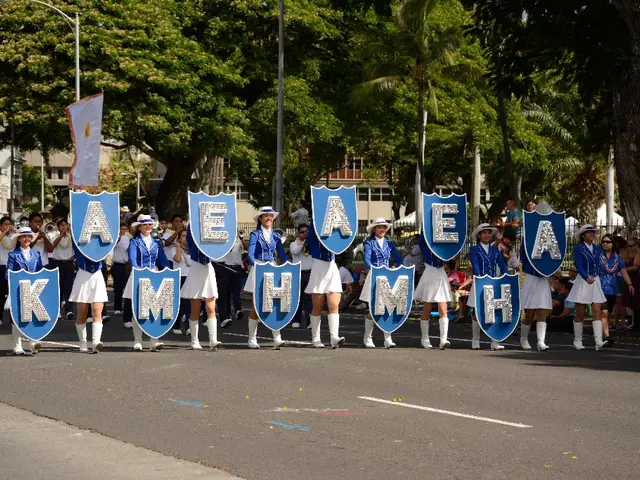 In this picture there are some school girls holding the alphabet board in the hand and walking on...