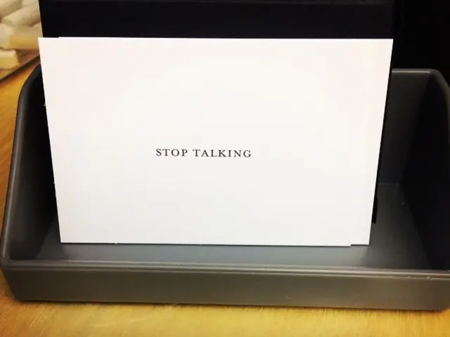 This seems like a printer box and there is a paper is on that, there is a text "Stop talking" is...
