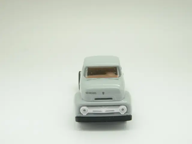 Here we can see a toy car. Background it is in white color.