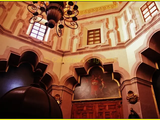 This is clicked inside a building, there is a photograph in the front above the door and there is a...