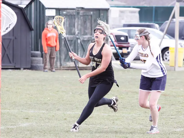 In this picture both the women are running with holding stick in their hands and on left side woman...