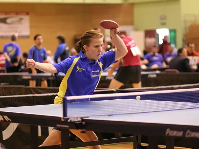 This woman is highlighted in this picture. She holds a bat and plays a table tennis. Far few...