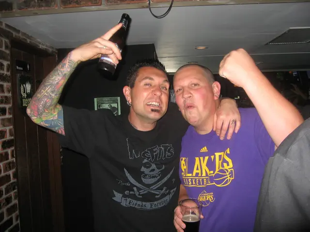 This picture describes about group of people, in the left side of the given image a man holding a...