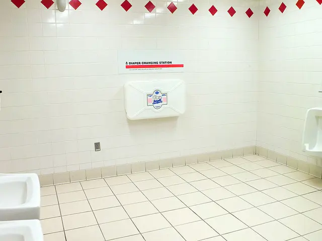 In the image it is a washroom, there are two sinks in the foreground and on the right side there is...