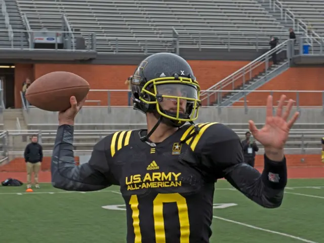 In this picture we can observe a rugby player wearing black color dress and a helmet on his head....