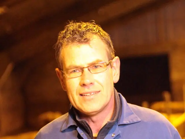 In this image we can see a man smiling.