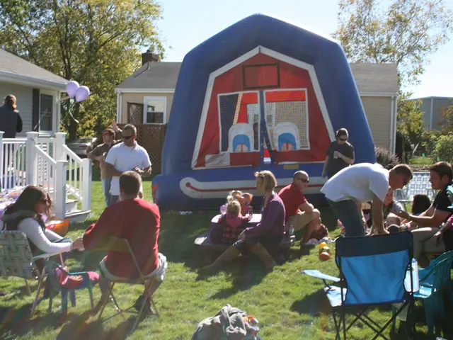 In the image we can see there are people who are sitting on ground and the ground is covered with...