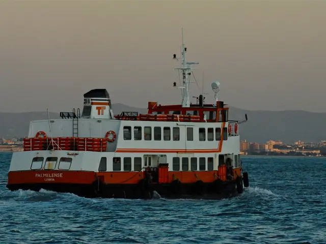 In this image in the center there is a ship sailing on the water. In the background there are...