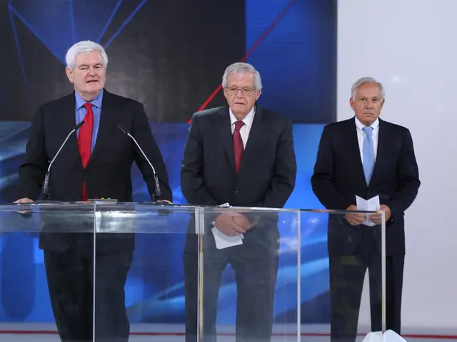 This picture describe about the old man wearing a black color coat with red color tie standing on...