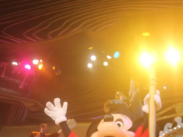 In the image in the center, we can see one Mickey Mouse doll holding some object. In the background...