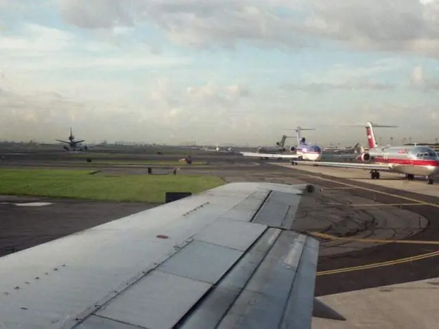 In the image there are few airplanes and in between the land there is a grass surface and in the...