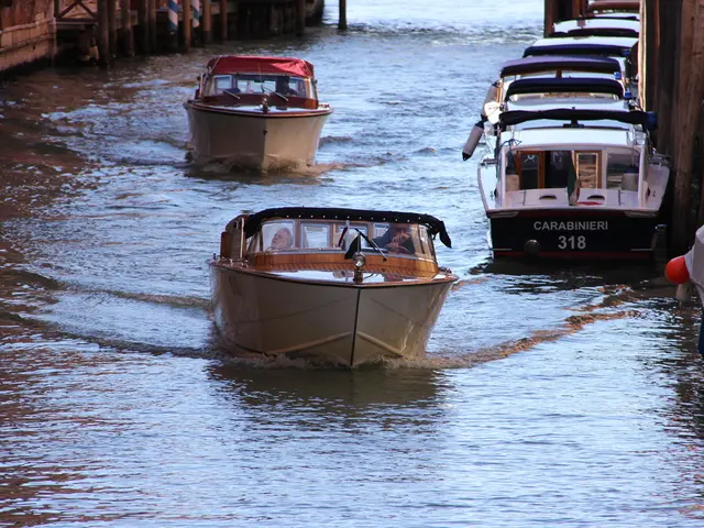 In this picture there are boats on the right side of the image and in the center of the image and...