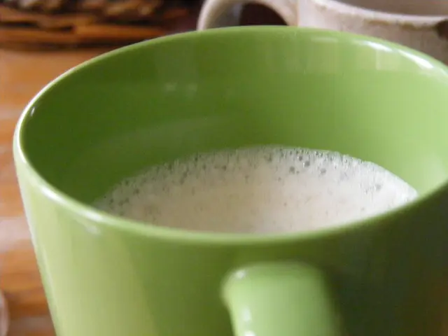 In the image in the center, we can see one table. On the table, we can see two coffee mugs, which...