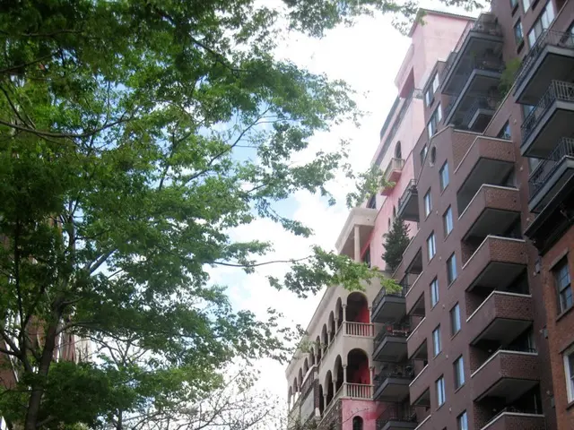 In the image we can see there are vehicles on the road. There are even many trees, buildings and...